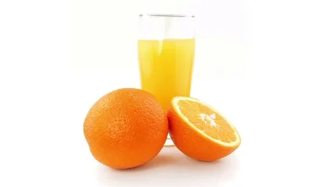 Oranges and orange juice Rotating on a white background Stock Footage 74486436