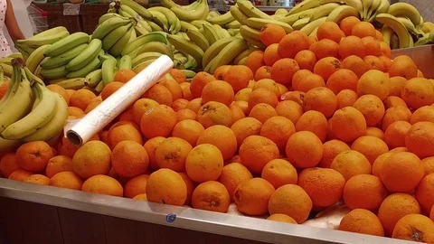 Oranges, bananas in a shop window. Stock Footage 77689556