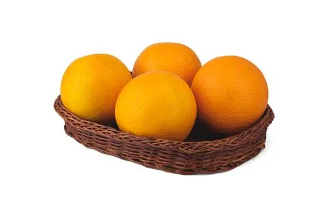 Oranges in a basket isolated on a white background. Stock Photos