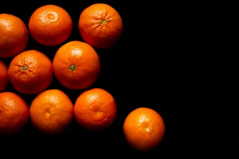 Oranges on black background Stock Photos