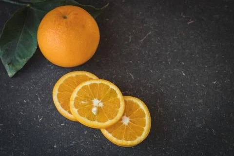 Oranges in black background Stock Photos