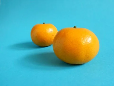 Oranges on blue Stock Photos