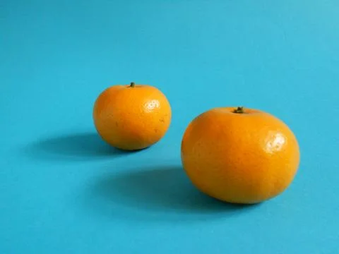 Oranges on blue Stock Photos