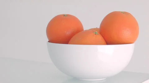 Oranges in a bowl Stock Footage 34423812