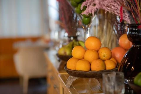 Oranges in a bowl on a fruit table Stock Photos