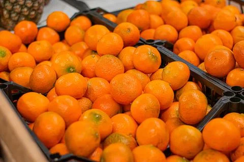 Oranges at the boxes in stores Stock Photos