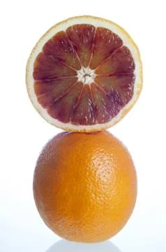 Oranges cut in half Stock Photos