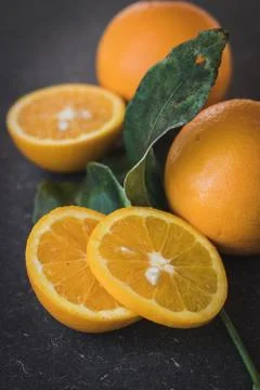 Oranges in dark background Stock Photos