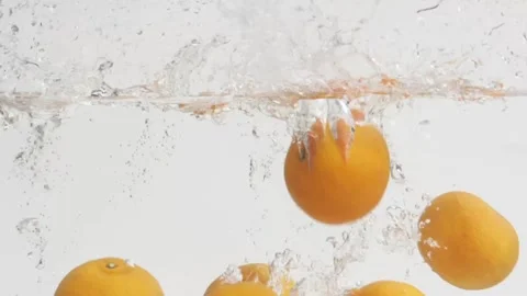 Oranges Dropping in the Water Stock Footage 239019297