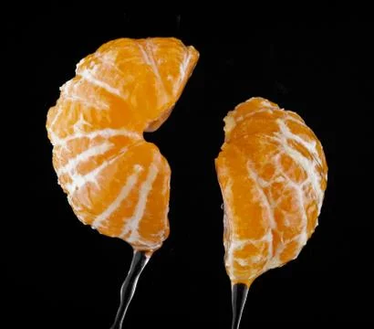 Oranges in drops of water Stock Photos
