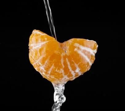 Oranges in drops of water Stock Photos