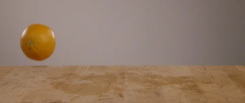 Oranges Falling Onto Cutting Board In Slow Motion 스톡 동영상 105374635