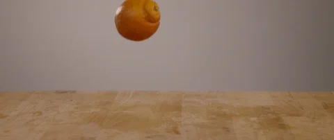 Oranges Falling Onto Cutting Board In Slow Motion 스톡 동영상 105375931