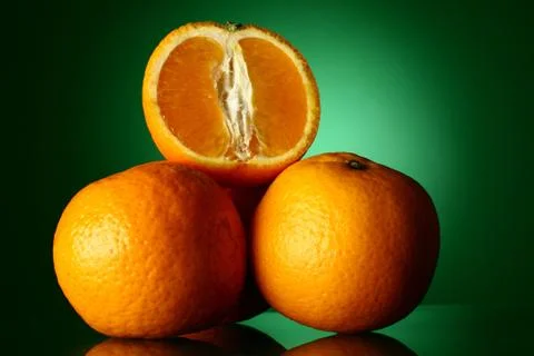 Oranges on green Stock Photos