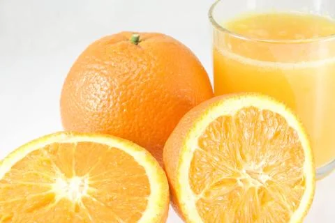 Oranges with juice Stock Photos