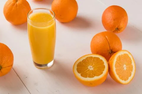 Oranges with juice Stock Photos