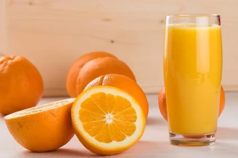 Oranges with juice Stock Photos