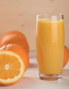 Oranges with juice Stock Photos
