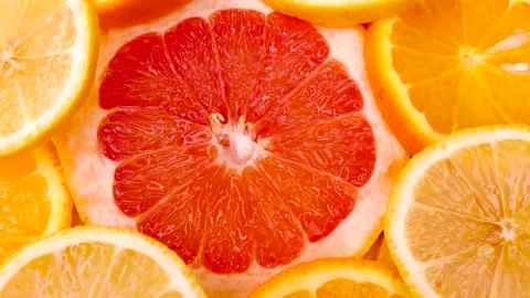 Oranges, lemons and grapefruit spinning on the table Stock Footage 235054342