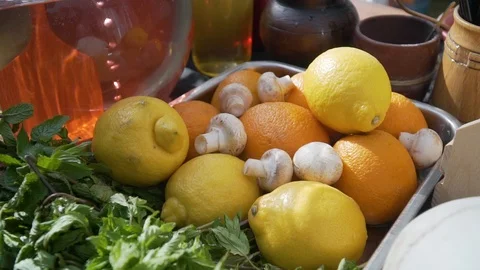 Oranges, lemons, champignons and mint on a tray Stock Footage 112830768