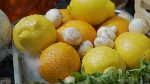 Oranges, lemons, champignons and mint on a tray Stock Footage 112830861