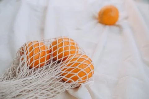 Oranges lying on white blanket Stock Photos