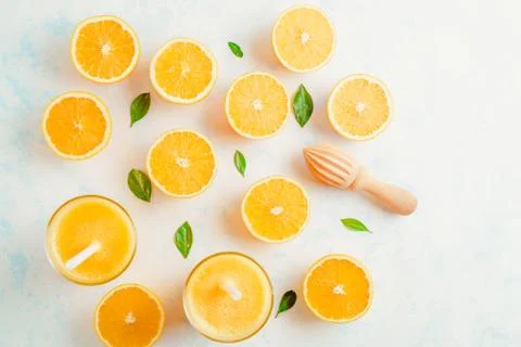 Oranges for making juice, pattern, on a blue background Stock Photos