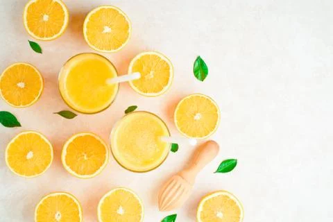 Oranges for making juice, pattern, on a blue background Stock Photos