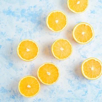 Oranges for making juice, pattern, on a blue background Stock Photos