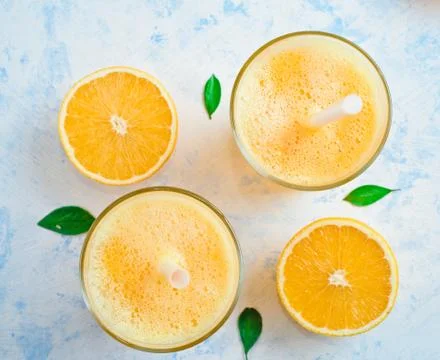 Oranges for making juice, pattern, on a blue background Stock Photos