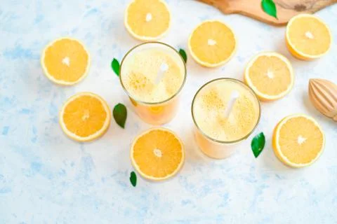 Oranges for making juice, pattern, on a blue background Stock Photos