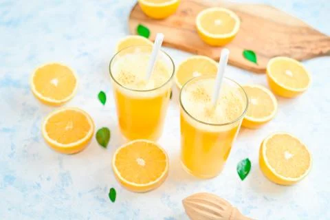 Oranges for making juice, pattern, on a blue background 写真素材