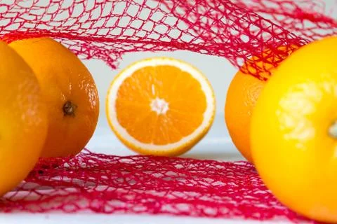 Oranges on the net Stock Photos