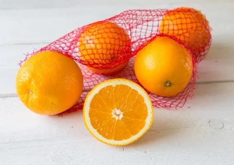 Oranges on the net Stock Photos