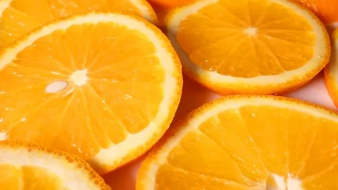 Oranges. Orange slices rotating pattern macro texture background backdrop Video stock 91381557