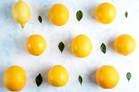 Oranges pattern isolated on blue background, top view, flat lay Stock Photos