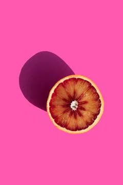 Oranges on a pink background Stock Photos