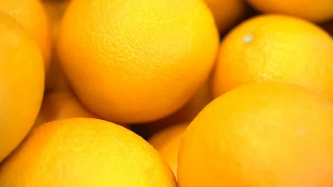 Oranges in the plate, lie on the kitchen table close-up shot Stock Footage 107077592