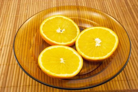 Oranges on a plate Stock Photos