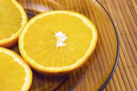 Oranges on a plate Stock Photos