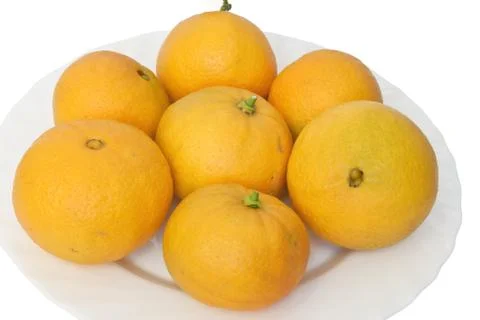 Oranges on plate Stock Photos