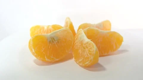 Oranges rotate on the stand 4k bright orange ripe tangerines rotate on their axi Stock Footage 164255897