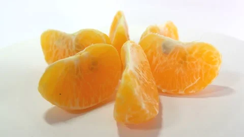 Oranges rotate on the stand 4k bright orange ripe tangerines rotate on their axi Stock Footage 164255954