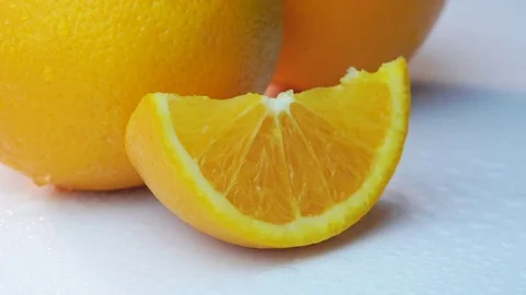 Oranges Rotating On White Table Stock Footage 82592059