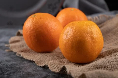 Oranges on a rustic background. Stock Photos