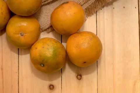 Oranges on rustic wooden table Stock Photos