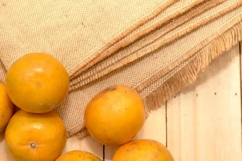 Oranges on rustic wooden table Stock Photos