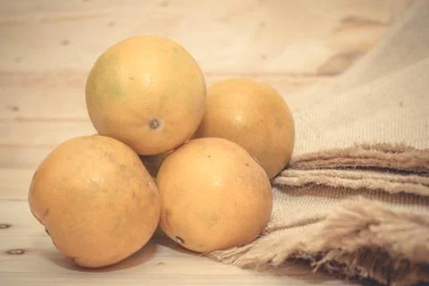 Oranges on rustic wooden table Stock Photos