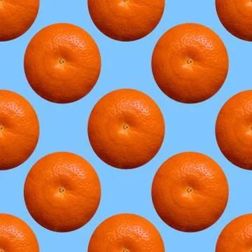Oranges seamless texture on the blue background. Stock Photos
