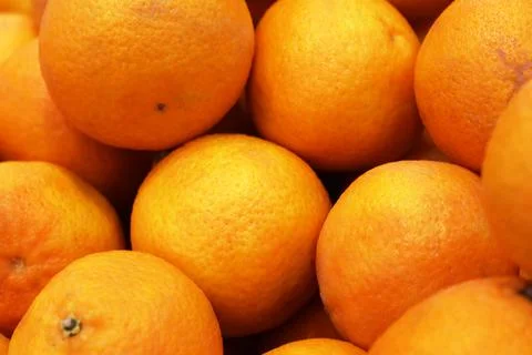 Oranges on the shelf in the store close-up. Stock Photos